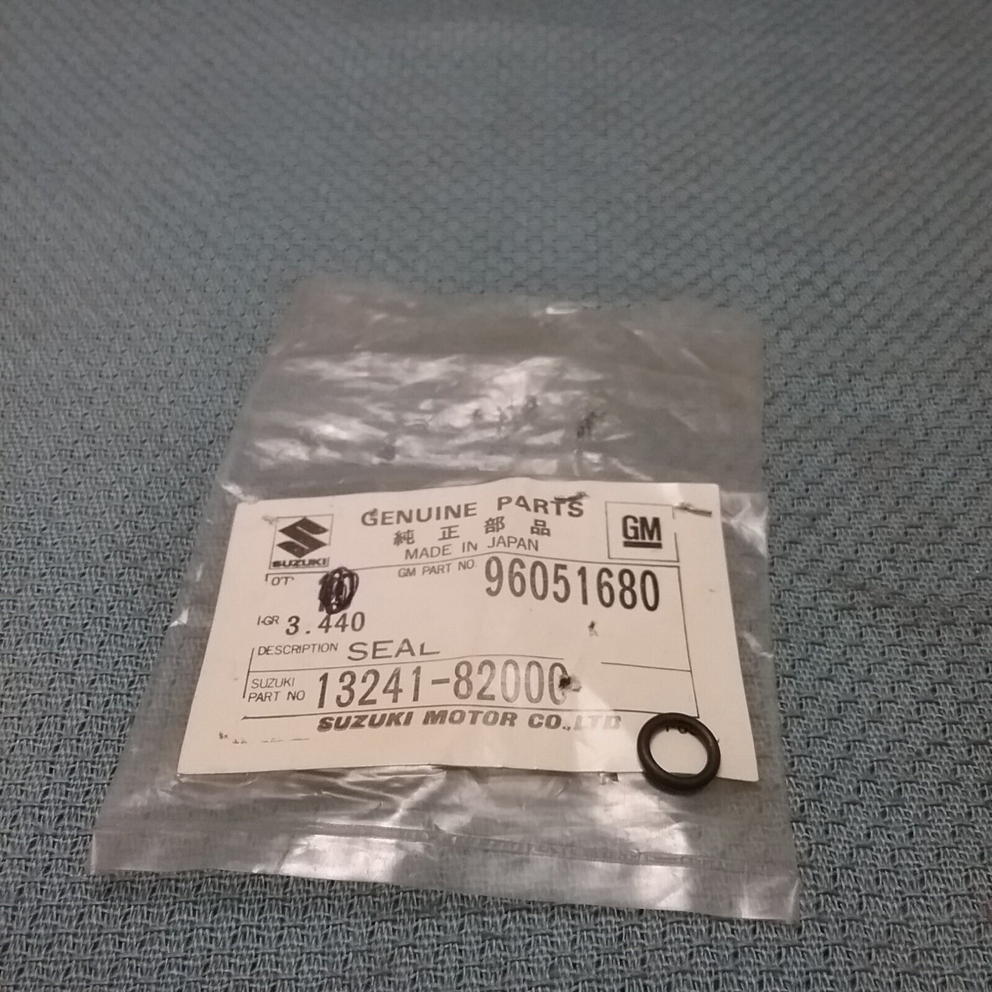 NEW GENUINE SUZUKI 13241-82000 SEAL, THROTTLE CONTROL GM 96051680
