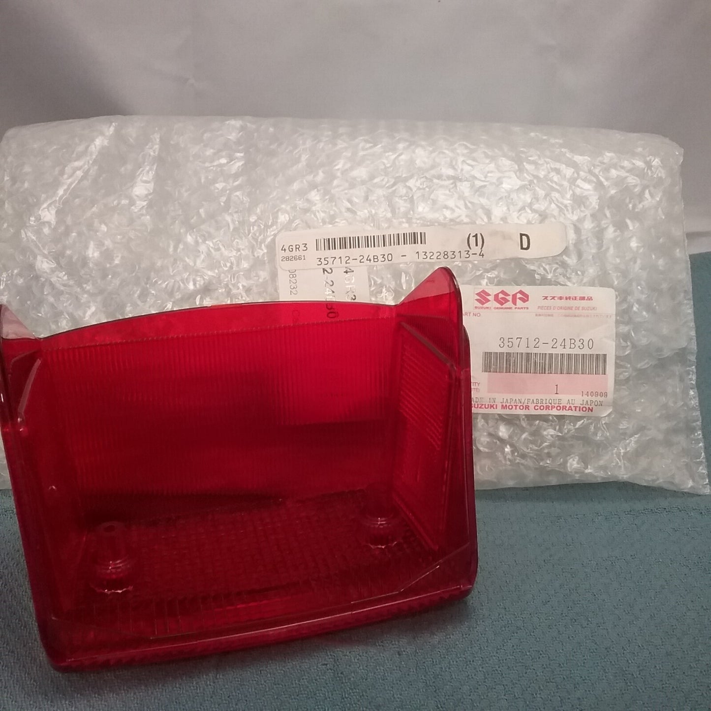 NEW GENUINE SUZUKI 35712-24B30 RED LENS LS650 1986-2019