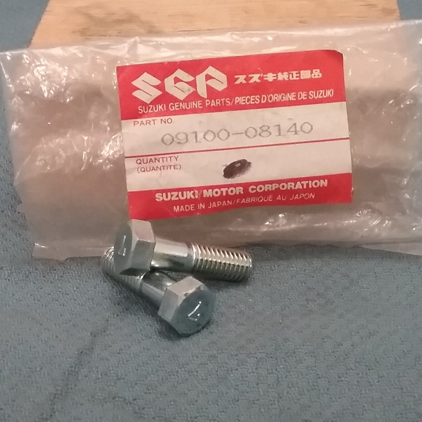 NEW GENUINE SUZUKI 09100-08140 BOLT, FRONT WHEEL 1977-1983