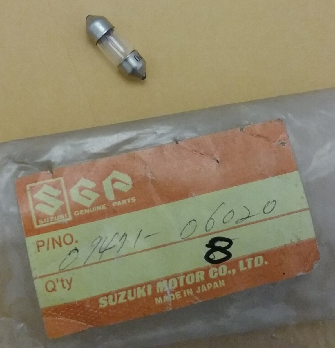 NEW GENIUNE SUZUKI 09471-06020 TAIL LAMP BULB 6V,3W DS100