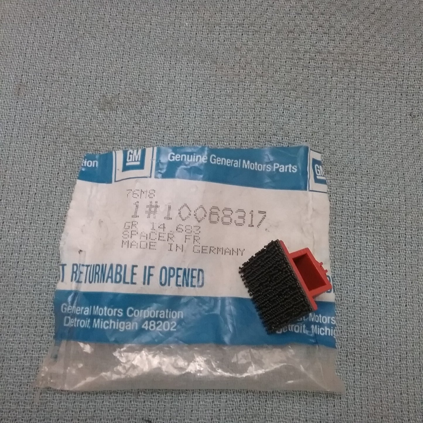 NEW GENUINE GM 10068317 SPACER, FRONT DOOR TRIM GR 14.683