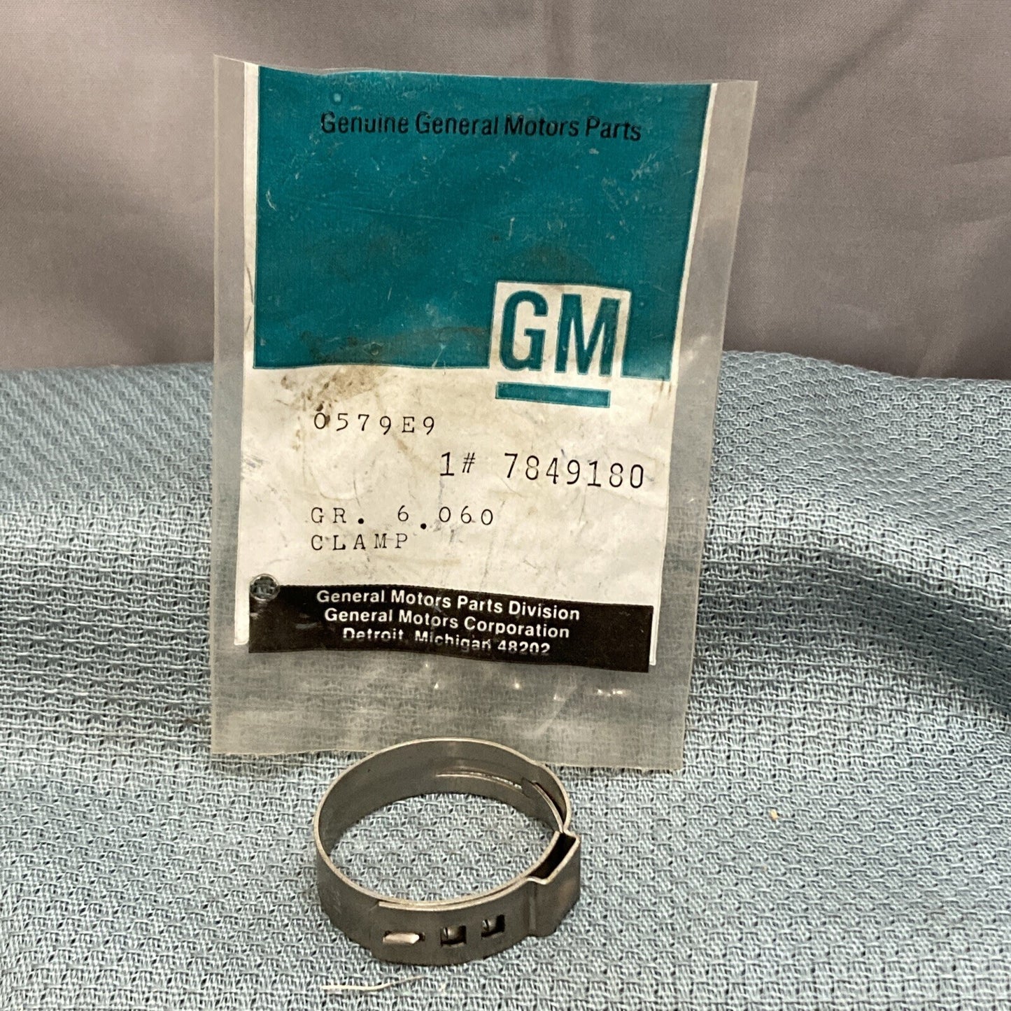 NEW GENUINE GM 7849180 CLAMP, FRONT WHEEL DRIVE SHAFT BOOT RETAINER 1988-1991