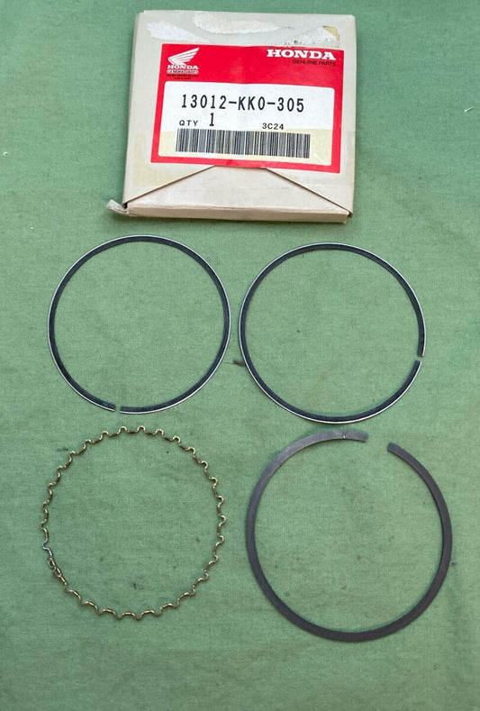 NEW GENUINE HONDA 13012-KK0-305 RING SET, PISTON (OVER SIZE) (0.25)