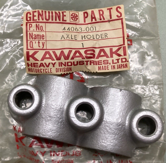 NEW GENUINE KAWASAKI 44063-001 HOLDER FRONT FORK AXLE