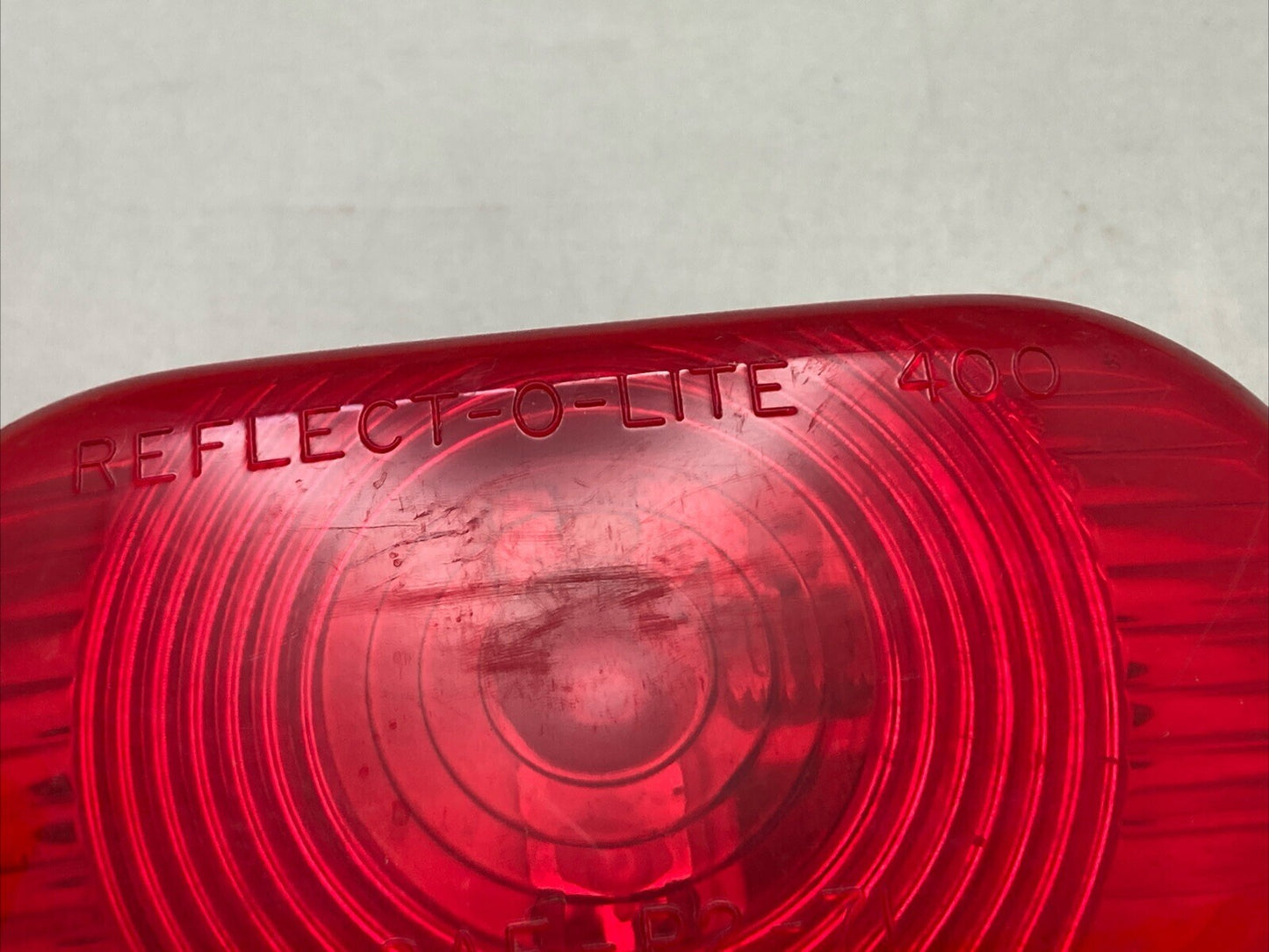 NEW REFLECT-O-LITE 400 SAE-P2-71 RED LIGHT CASING 73C103