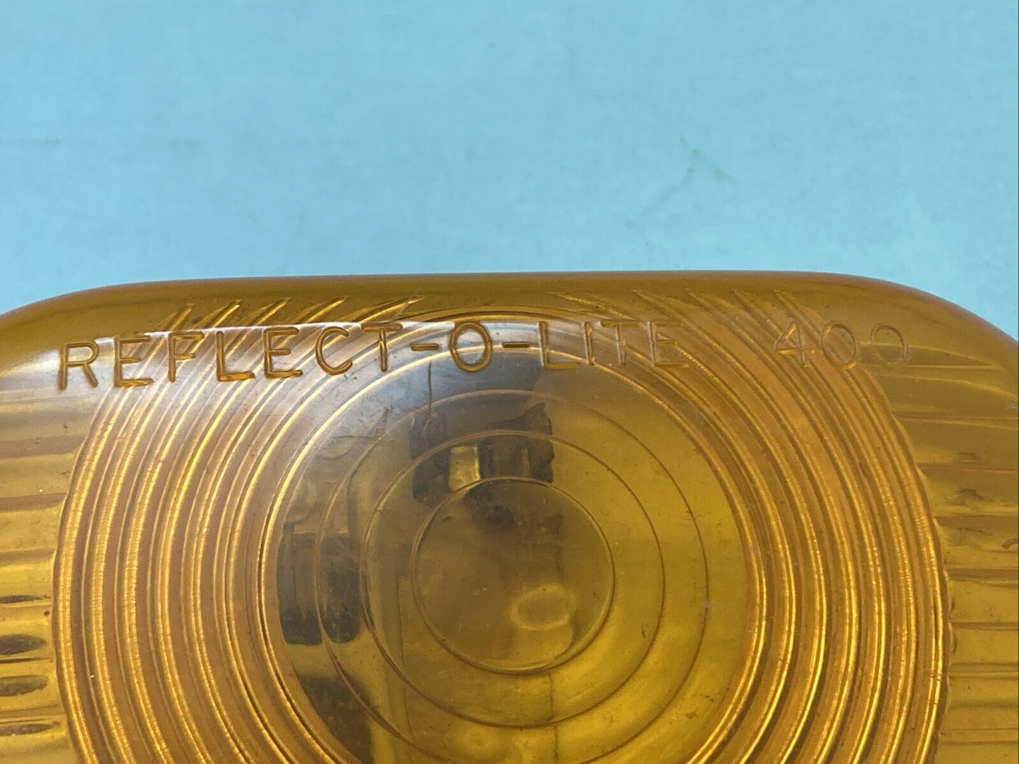 NEW REFLECT-O-LITE 400 SAE-P2-71 AMBER LENS CASING 73C103