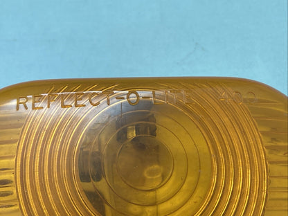 NEW REFLECT-O-LITE 400 SAE-P2-71 AMBER LENS CASING 73C103