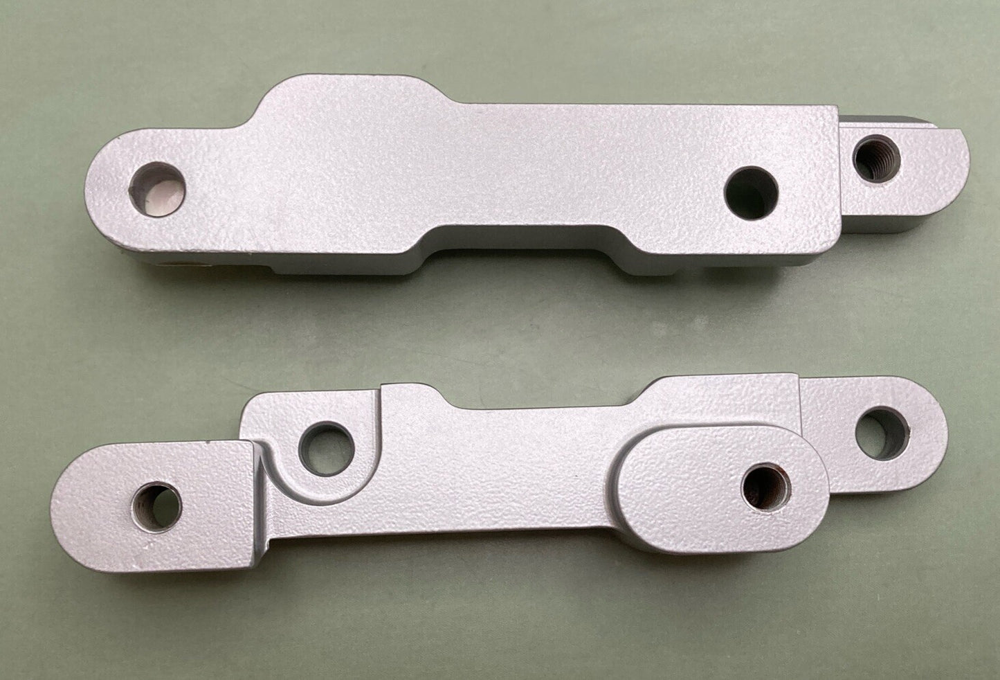 NEW GENUINE VICTORY 2874757-385 FOOTPEG RELOCATION BACK, SILVER, POLARIS