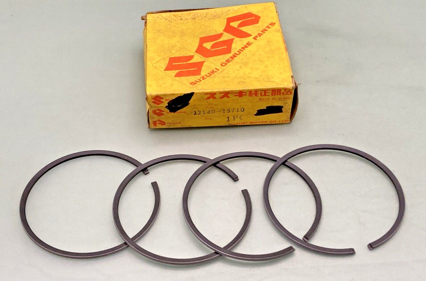 NEW GENUINE SUZUKI 12140-15710 PISTON RING ASSY
