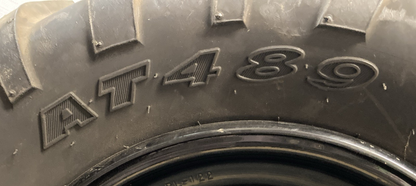 NEW GENUINE CARLISLE AT489 24X11-12 4 PLY ATV TIRE AND 4 LUG RIM