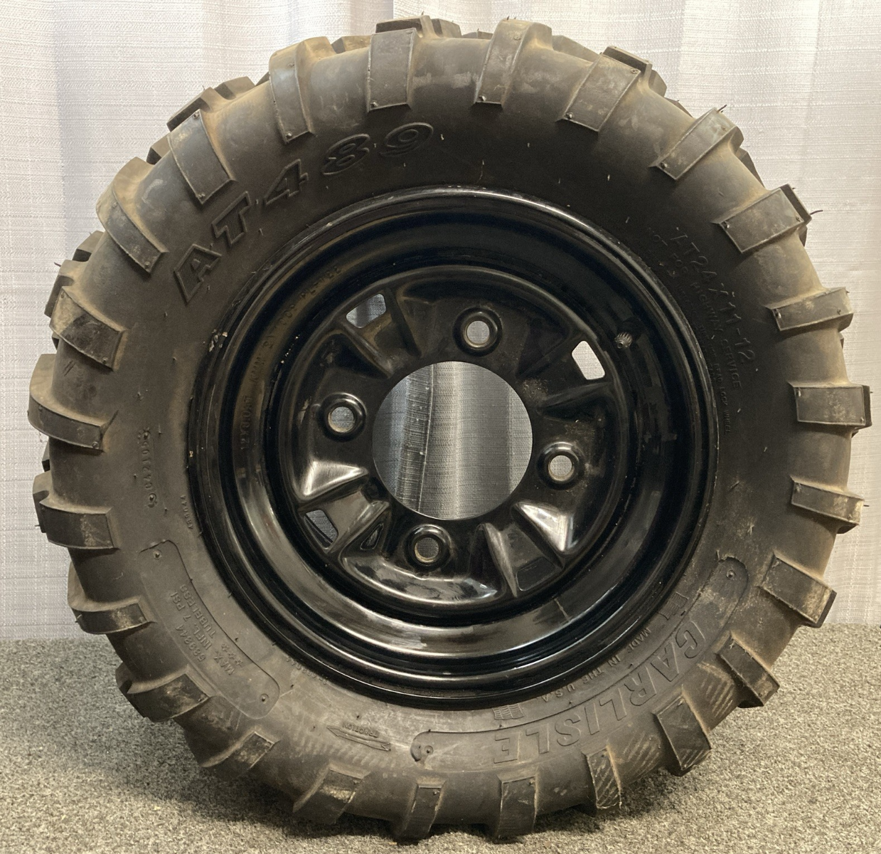 NEW GENUINE CARLISLE AT489 24X11-12 4 PLY ATV TIRE AND 4 LUG RIM