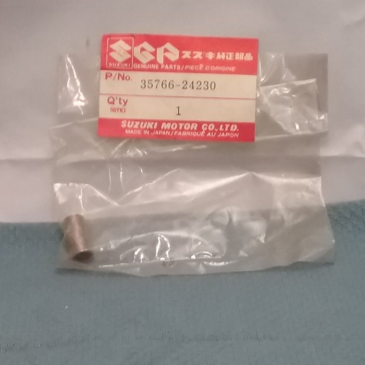 NEW GENUINE SUZUKI 35766-24230 SPACER, TAIL LAMP LT125 ALT125 1983